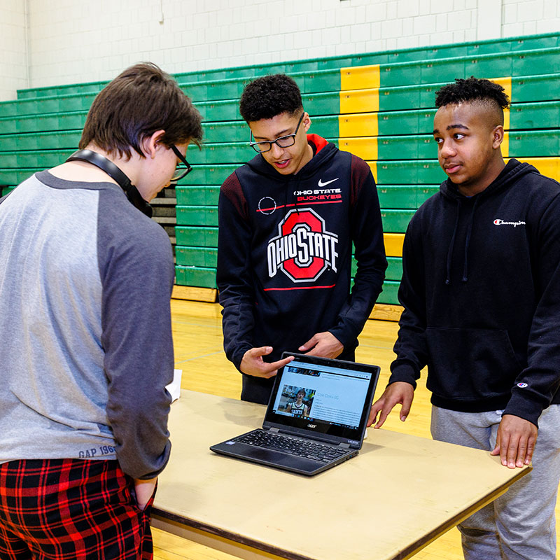 Students working on a tech project.