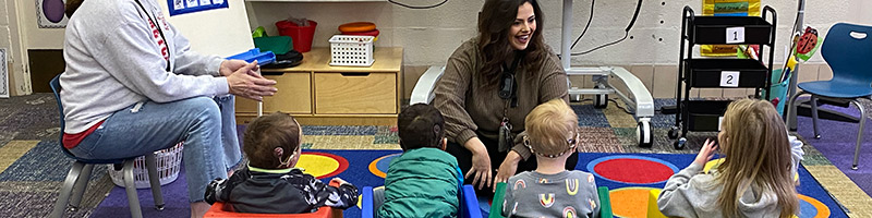 Teacher in a classroom with kids with special needs