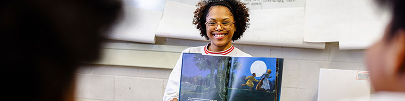 Professor reading to kids.