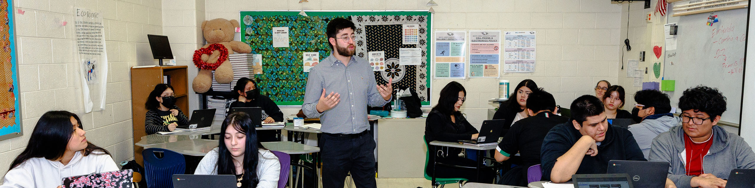 Teacher speaks to a classroom of students.