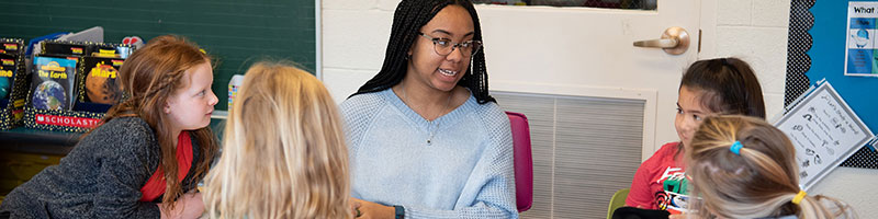 A teacher talking to students.