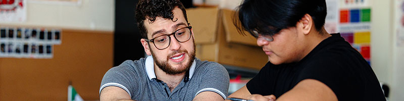 A teacher helping a student with some assignment