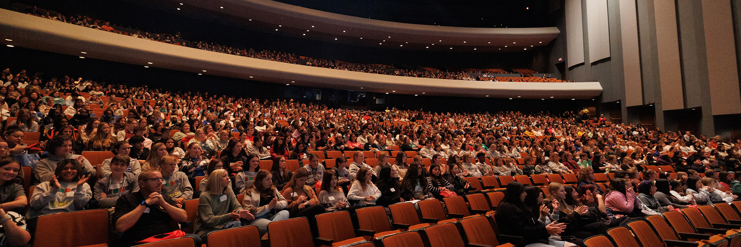 A large auditorium filled with attendees at a conference.